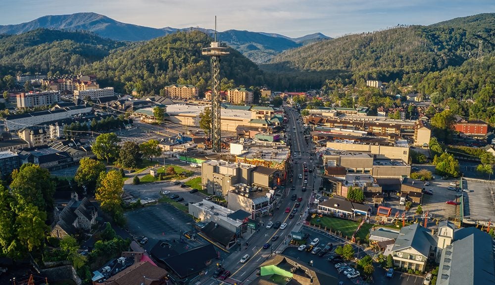 Aerial view of downtown Gatlinburg, surrounded by the Great Smoky Mountains.