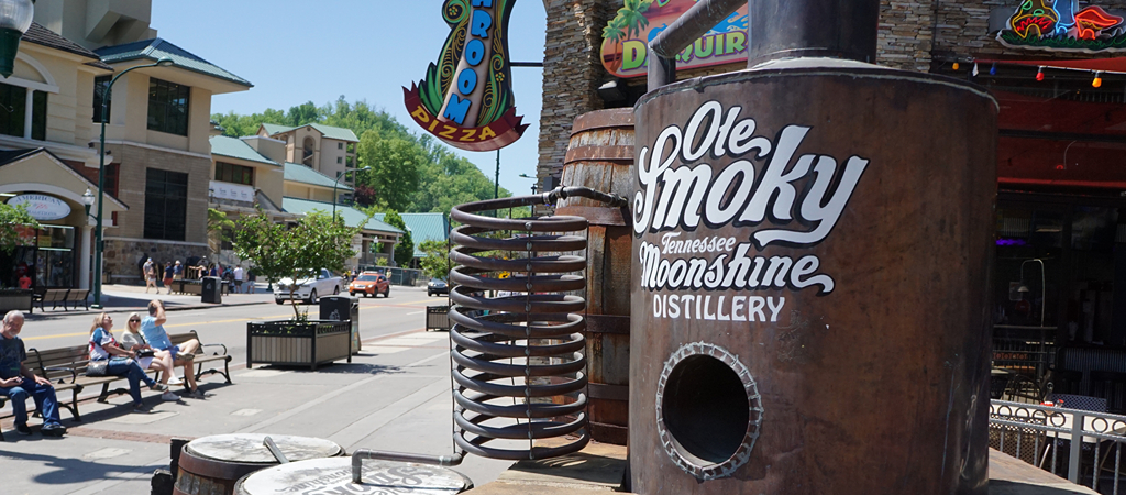 An installation of a classic Appalachian moonshine still on the Parkway in downtown Gatlinburg reads Ole Smoky Moonshine Distillery.