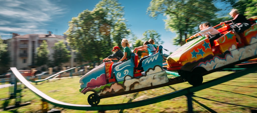 Kids Riding a Small Roller Coaster A fast snapshot of kids riding a small roller coaster.