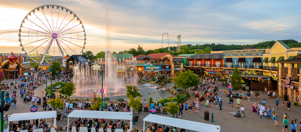The Island in Pigeon Forge Shopping Complex An aerial view of The Island in Pigeon Forge, showcasing the many shops, show fountain, and The Great Smoky Wheel.
